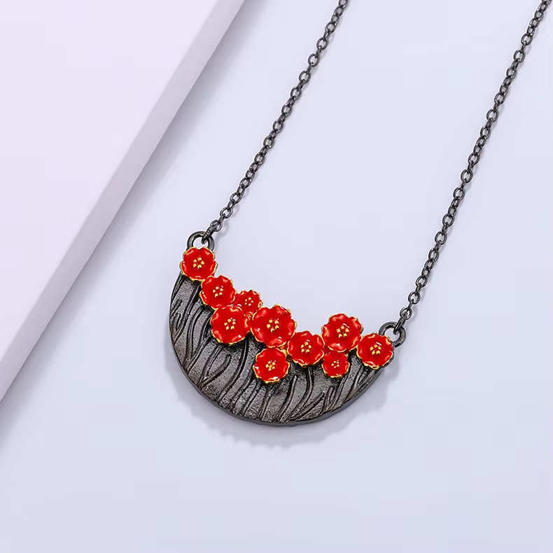 Necklace with red flowers in black basket