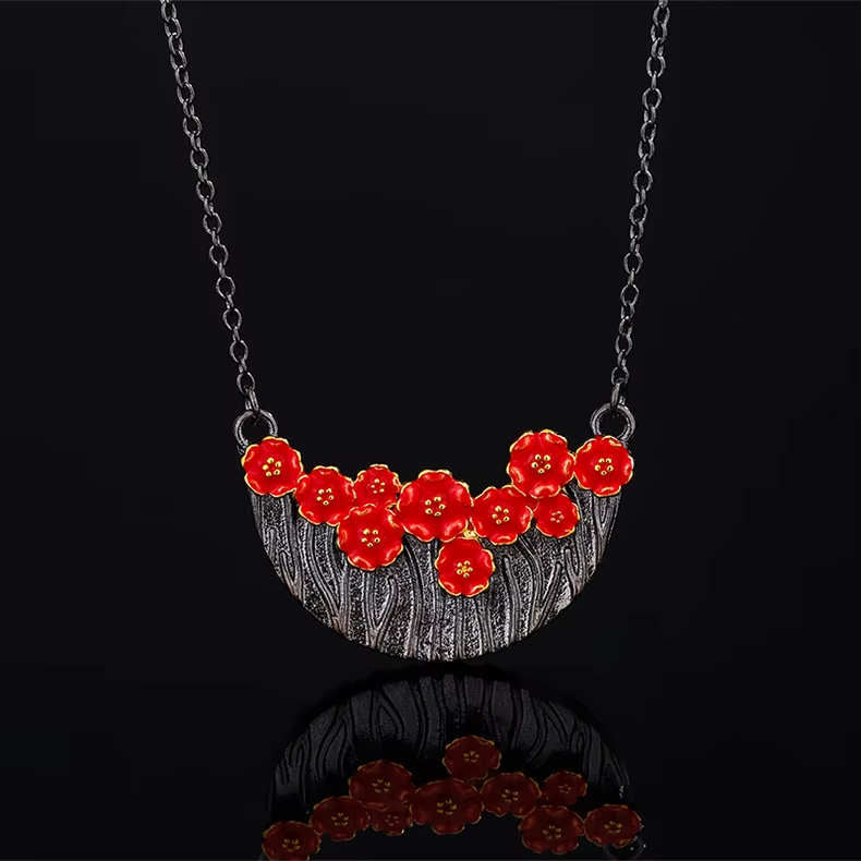 Necklace with red flowers in black basket