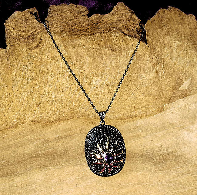 Gold Sun with Purple Center On Black Necklace