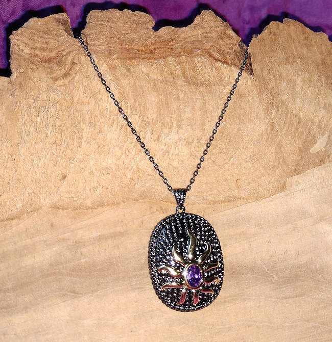 Gold Sun with Purple Center On Black Necklace